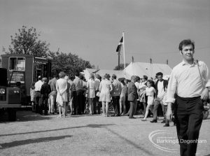 Dagenham Town Show 1970, showing queue of visitors waiting for hamburgers, and close-up of man walking past, 1970