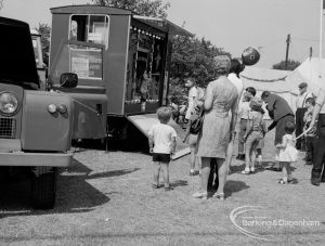 Dagenham Town Show 1970, showing parents and young children watching the mechanical organ, 1970