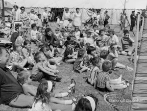 Dagenham Town Show 1970, showing a large group of children and adults sitting on the ground, 1970