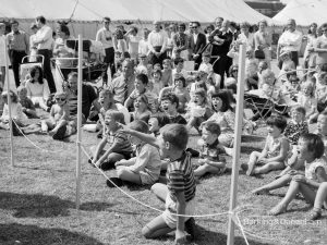 Dagenham Town Show 1970, showing a group of children sitting on the ground and cheering, 1970