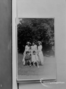 Photographic negative copy of old Valence House Museum photograph, showing group of five, including three women standing, in period dress, 1970