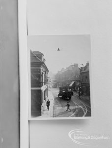 Photographic negative copy of old Valence House Museum photograph, showing view of street [possibly in Barking], 1970