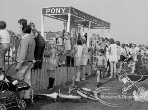 Barking Carnival 1970, showing spectators watching the carnival through railings, 1970