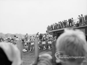 Barking Carnival 1970, showing spectators, some lining the pavilion roof, 1970