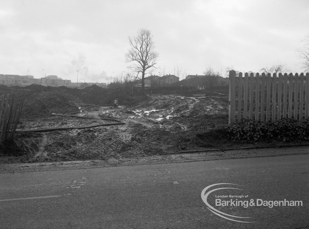 Dagenham old village housing development, showing view from gate of muddy ground, looking south, 1971