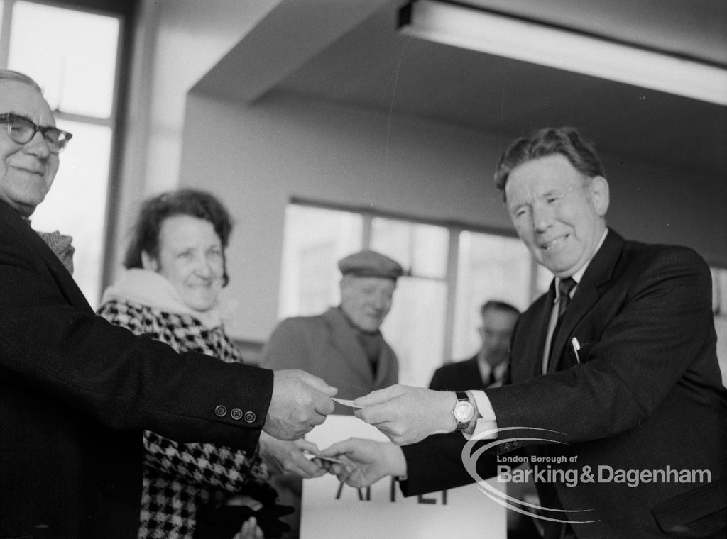 Welfare, with the introduction of bus permits for certain elderly people, showing Hanna Ludden and Sidney Holloway receiving first permits from Councillor Tibble during first day of issue, 1971