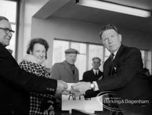Welfare, with the introduction of bus permits for certain elderly people, showing Hanna Ludden and Sidney Holloway receiving first permits from Councillor Tibble during first day of issue, 1971