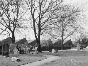 A class of small school children standing by trees at St Margaret’s Parish Church, Barking, 1971