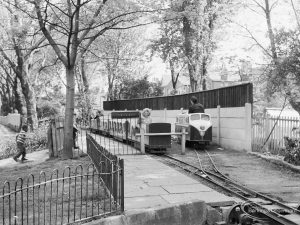 The miniature railway, station and passengers at Barking Park, Barking, 1971