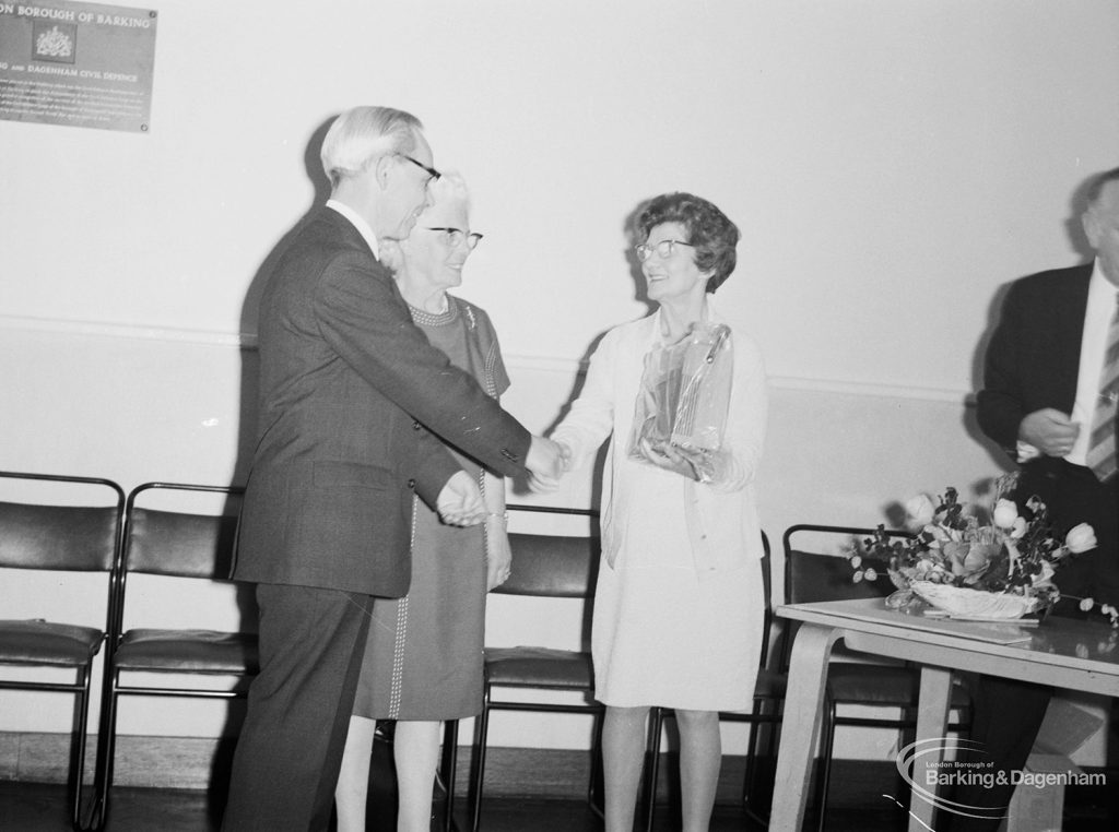 London Borough of Barking Libraries Department staff, showing presentation of gift to Principal Assistant (Adult Services) Mr William McKenzie at his retirement, with Mrs McKenzie and Alderman Mrs Thomas, 1971
