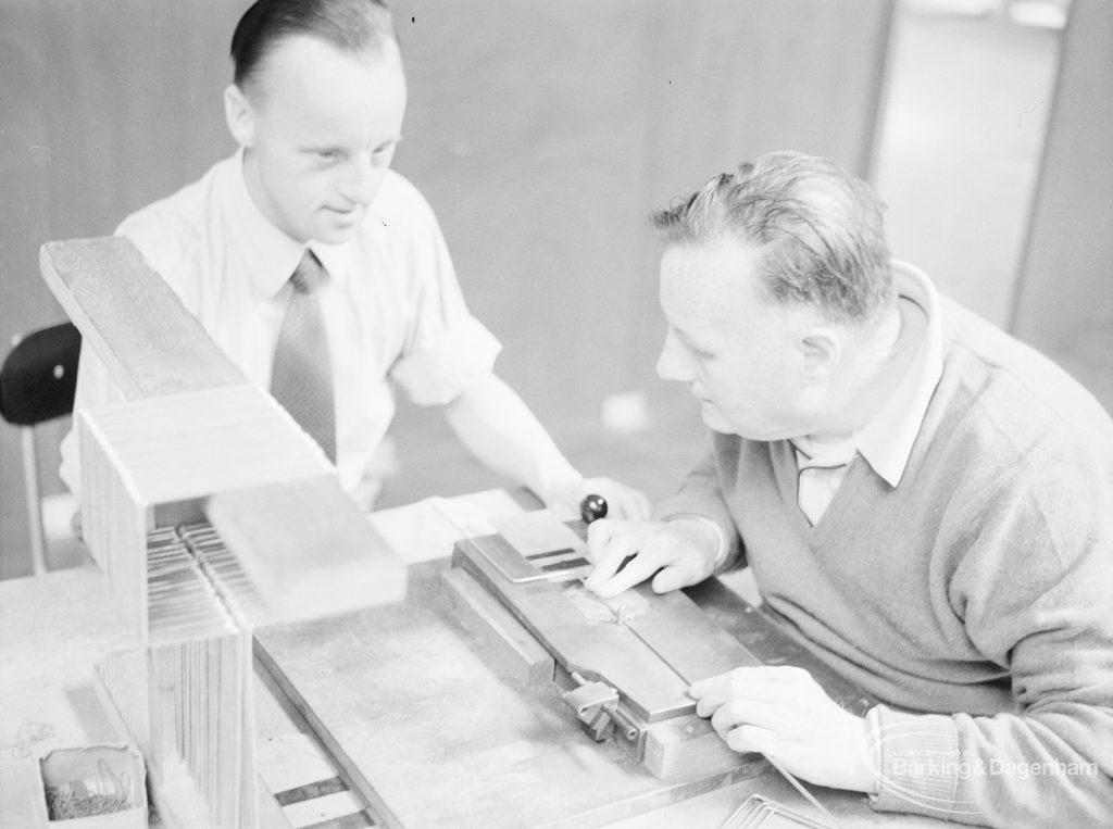 London Borough of Barking Welfare Department, Gascoigne Training Centre for Adults, showing two men operating equipment [possibly stamping machine], 1971