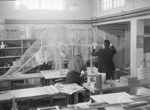 London Borough of Barking Welfare Department, Porters Avenue Occupation Centre, Dagenham, showing the chicken wire shape of the Triceratops under construction on bench, 1971