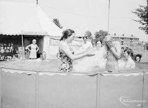 Dagenham Town Show 1971 at Central Park, Dagenham, showing girls splashing in swimming pool, 1971