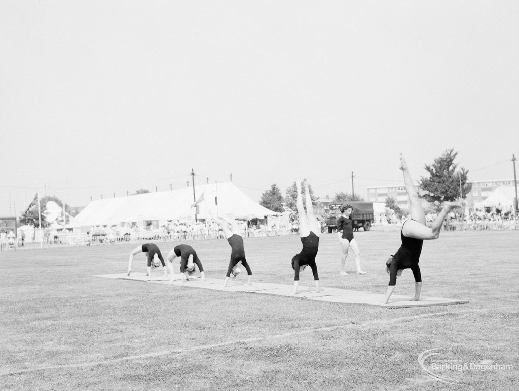 Dagenham Town Show 1971 at Central Park, Dagenham, showing Athletics display, with girls performing somersaults in arena, 1971