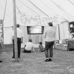 Dagenham Town Show 1971 at Central Park, Dagenham, showing visitors viewing outdoor film at Fanshawe Film Society stand, 1971