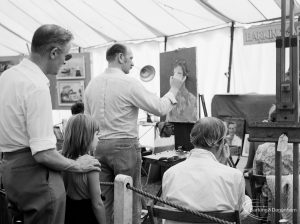 Dagenham Town Show 1971 at Central Park, Dagenham, showing Barking Art Society display with artist painting a portrait on an easel,1971