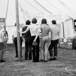 Dagenham Town Show 1971 at Central Park, Dagenham, showing a group of men watching a show at the Fanshawe Film Society stand,1971