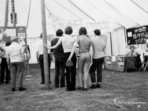 Dagenham Town Show 1971 at Central Park, Dagenham, showing a group of men watching a show at the Fanshawe Film Society stand,1971