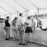 Dagenham Town Show 1971 at Central Park, Dagenham, showing visitors enquiring at the Barking Flower Arrangment Club stand,1971