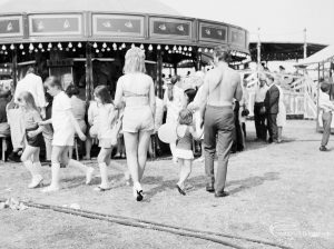 Dagenham Town Show 1971 at Central Park, Dagenham, showing visitors standing around by the carousel, 1971