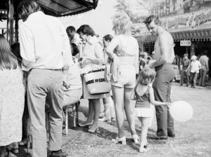 Dagenham Town Show 1971 at Central Park, Dagenham, showing visitors at the fairground attractions,1971