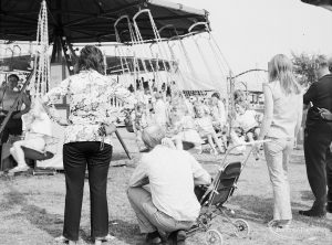 Dagenham Town Show 1971 at Central Park, Dagenham, showing visitors at the fairground attractions,1971