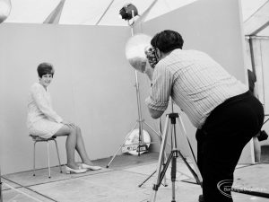 Dagenham Town Show 1971 at Central Park, Dagenham, showing woman being photographed by a professional photographer, 1971