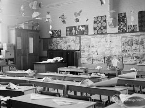 Village Infants School, Church Elm Lane, Dagenham interior [closed 23 July 1971], showing classroom with children’s drawings, et cetera on wall, 1971