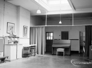 Village Infants School, Church Elm Lane, Dagenham interior [closed 23 July 1971], showing main hall with curtained area, piano, cupboards, et cetera, 1971