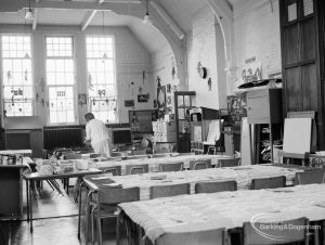 Village Infants School, Church Elm Lane, Dagenham interior [closed 23 July 1971], showing room [possibly main hall] with tables laid and rounded arched feature above window, 1971
