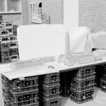 London Borough of Barking, Architect’s Department model of new Barking Library, showing view of the whole complex with piazza, Town Hall and Assembly Hall from distance, taken from south-east and mounted on metal crates in Town Hall yard, 1971
