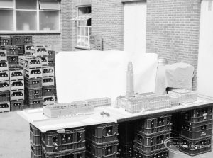 London Borough of Barking, Architect’s Department model of new Barking Library, showing view of the whole complex with piazza, Town Hall and Assembly Hall from distance, taken from south-east and mounted on metal crates in Town Hall yard, 1971