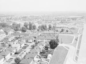Dagenham Old Village area, taken from top of Thaxted House, Siviter Way, showing St Peter and St Paul’s Parish Church (centre), housing and trees, 1971