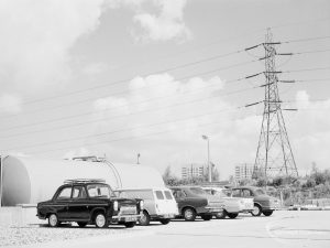 Sewage Works Reconstruction (Riverside Treatment Works) XXII, showing storage tank cylinder, transport vehicles and electric power pylon, 1971