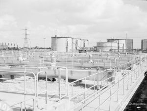 Sewage Works Reconstruction (Riverside Treatment Works) XXII, showing sewage mixing vats and crystals, with digesters in background and looking north-east, 1971