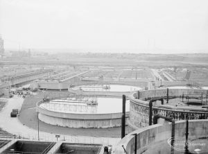 Sewage Works Reconstruction (Riverside Treatment Works) XXII, showing aerial view of site looking towards River Thames, with wide pools of clustered digesters, 1971