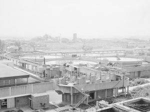 Sewage Works Reconstruction (Riverside Treatment Works) XXII, showing aerial view of construction of pump house, looking east with Dagenham Village in background, 1971