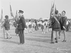Assembly and departure of Barking Carnival 1971 from Mayesbrook Park, showing standard bearers on the field, 1971