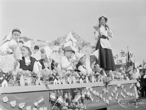 Assembly and departure of Barking Carnival 1971 from Mayesbrook Park, showing St John float behind a Dutch themed float with children in traditional Dutch costume, 1971