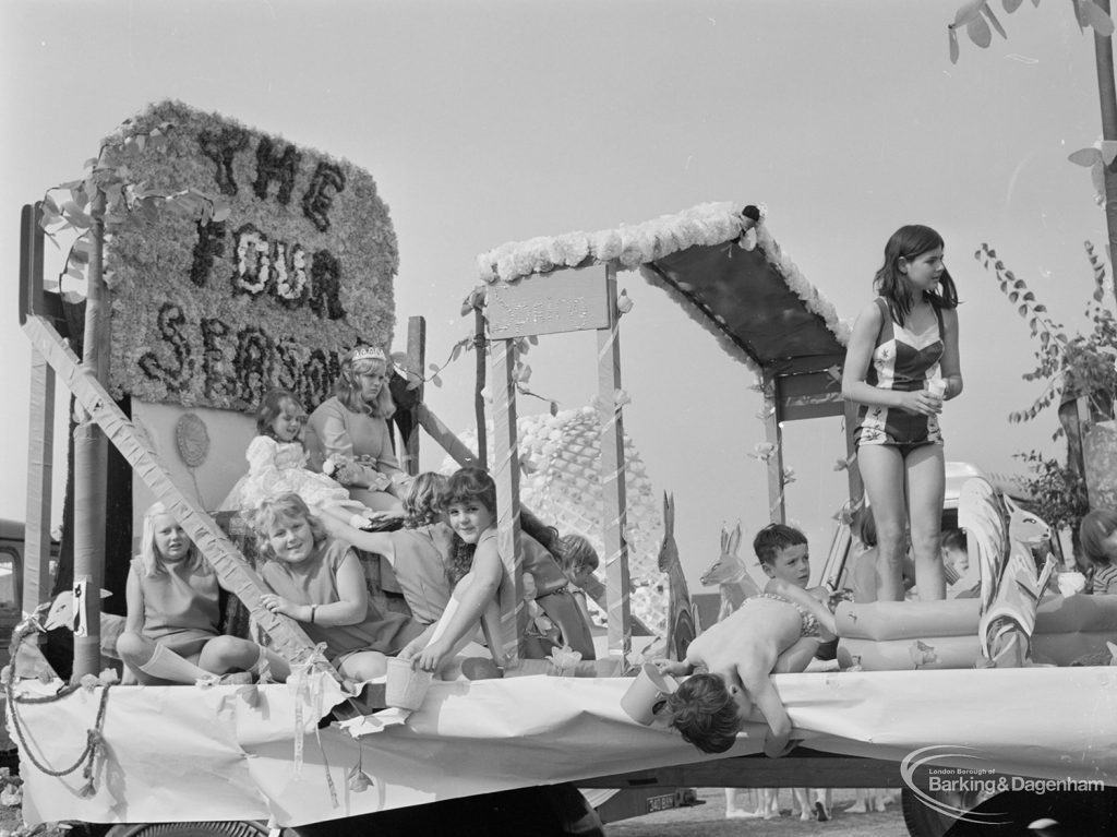 Assembly and departure of Barking Carnival 1971 from Mayesbrook Park, showing float entitled ‘The Four Seasons’ with a carnival queen and group of children, 1971