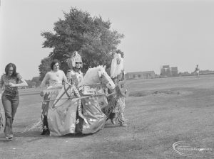 Barking Carnival 1971 from Mayesbrook Park, showing first prize adult winner of the fancy dress competiton, dressed as a mounted Medieval Knight, 1971