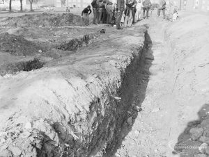 Barking Abbey recent excavation, showing long open trench looking north, with group of people at top, 1971
