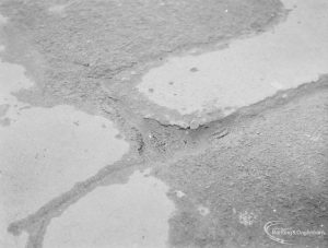 Highways, showing damaged tarmac paving at 72 High Road, Chadwell Heath, outside Old People’s Club, 1972