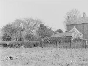 Site for Housing development at Paulatim Lodge, Chadwell Heath, taken after fire in roof and showing north end rear of Lodge with garden and trees, 1972