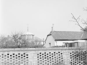 Site for Housing development at Paulatim Lodge, Chadwell Heath, taken after fire in roof and showing Tower and part of Holly Cottage to west of the Lodge, 1972