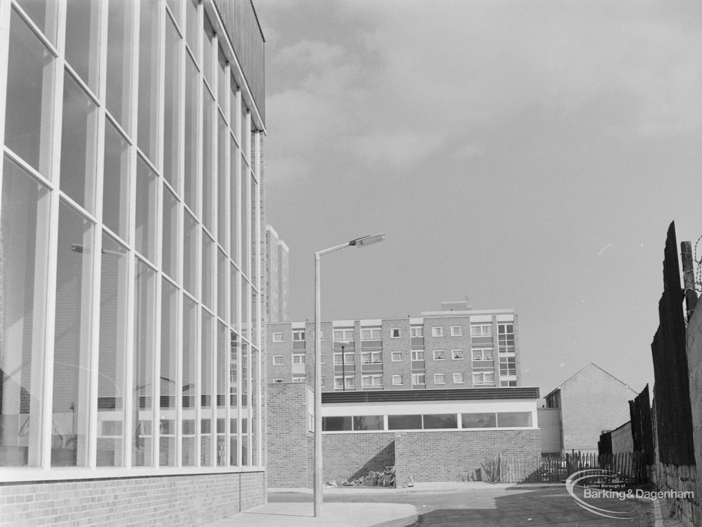 New Dagenham Swimming Pool at Becontree Heath, showing graceful vertical window (left) and flats, from north-west, 1972