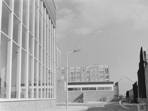 New Dagenham Swimming Pool at Becontree Heath, showing graceful vertical window (left) and flats, from north-west, 1972