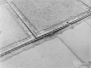 Highways, showing protruding manhole cover in High Road, Chadwell Heath, 1972