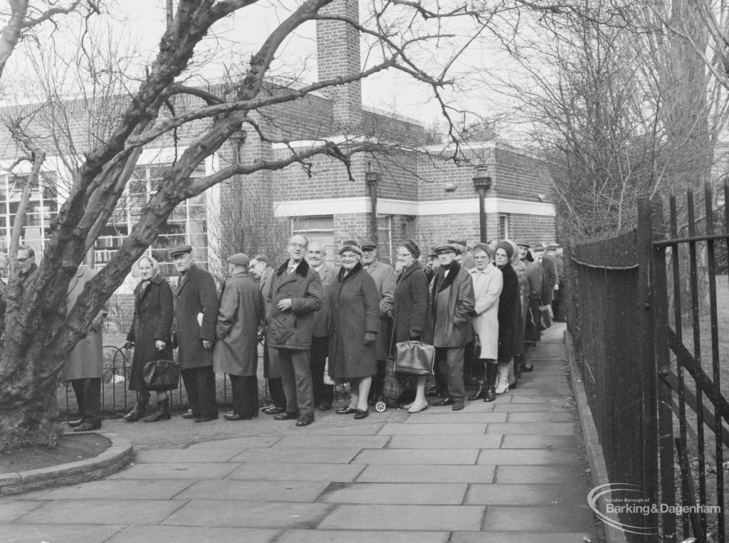 Middle section of queue for Senior Citizens’ bus permits at Valence Library, Dagenham, 1972