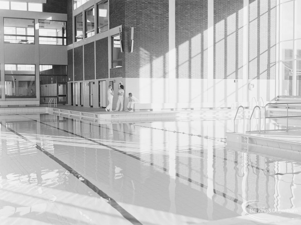 New Dagenham Swimming Pool at Becontree Heath, with reflections of south windows showing diving area, 1972